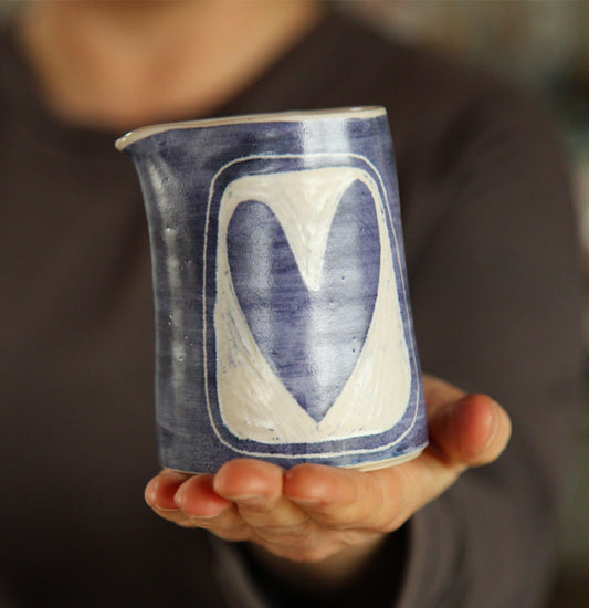 Stoneware blue and white pottery pourer with sgraffito heart 