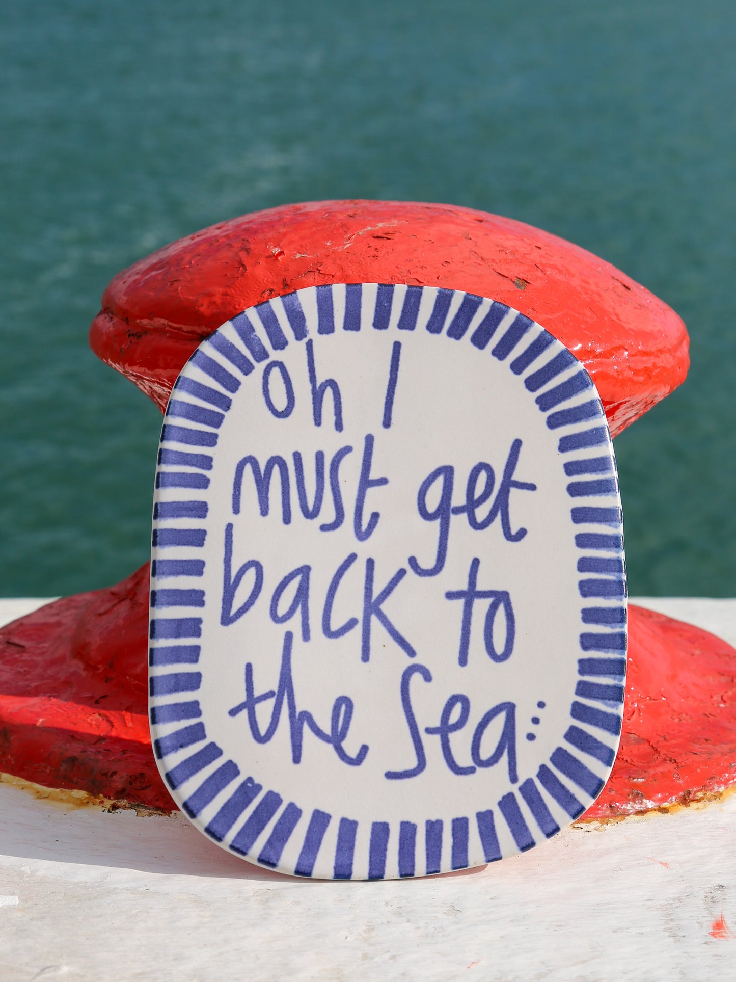 oh i must get back to the sea wall plaque